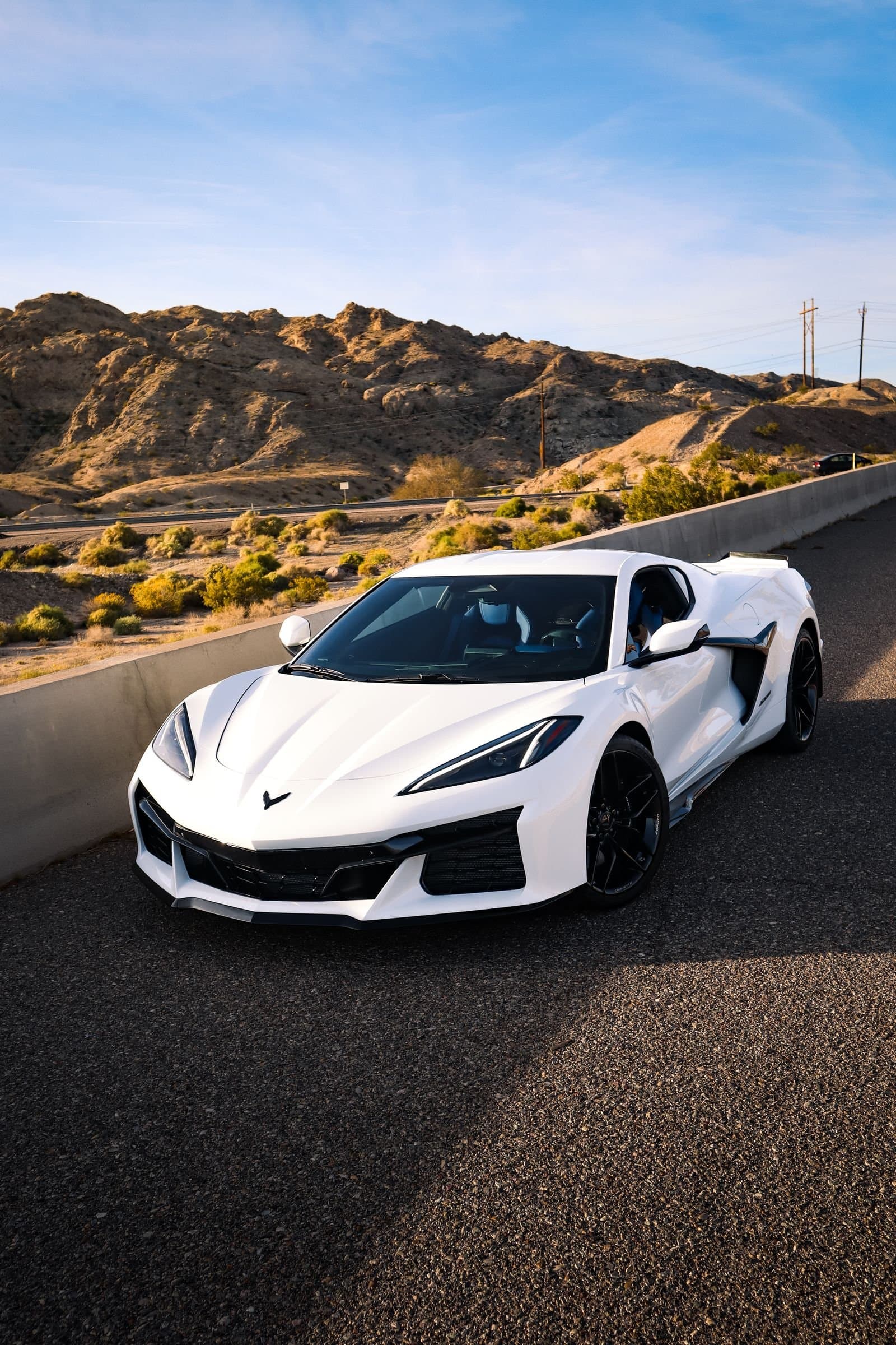 White sports car on a desert road near Laughlin, a comp-trip drive