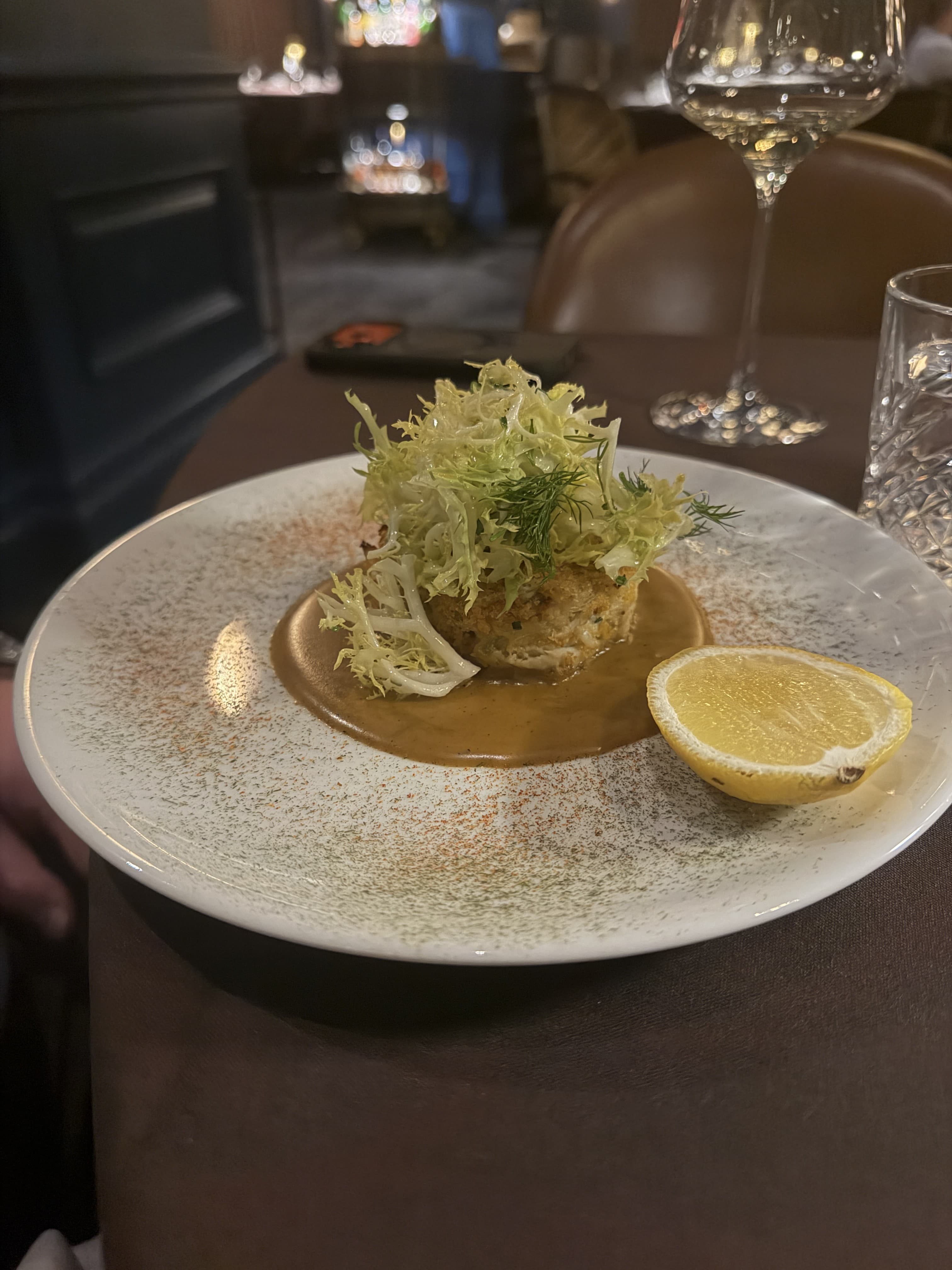 Crab cake on a restaurant plate, a casino comp dining credit meal