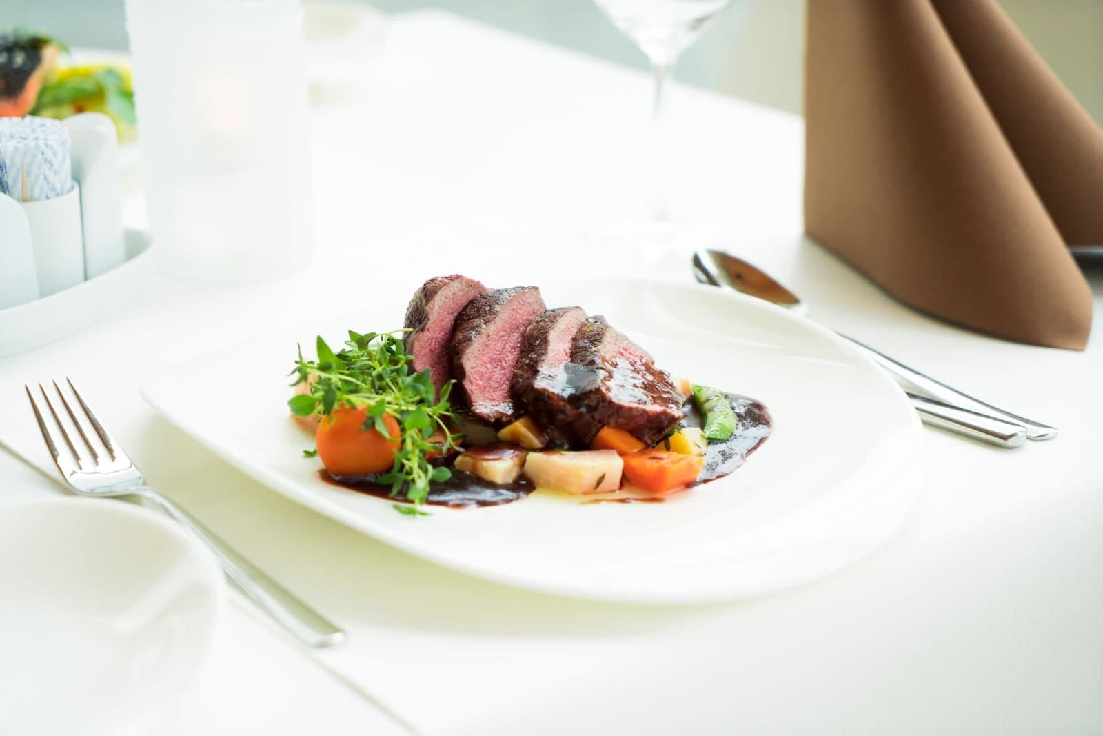 Sliced steak on a white plate, a casino comp dinner