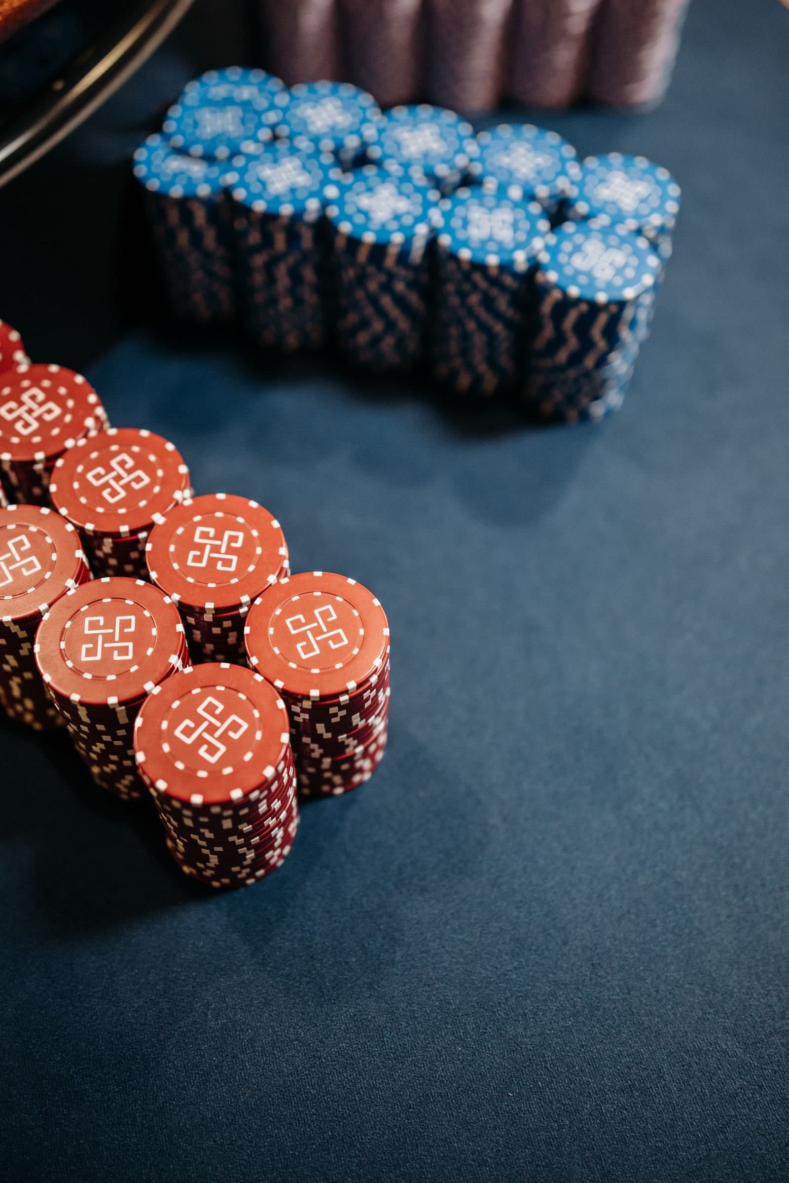 Colorful chip stacks on a roulette table